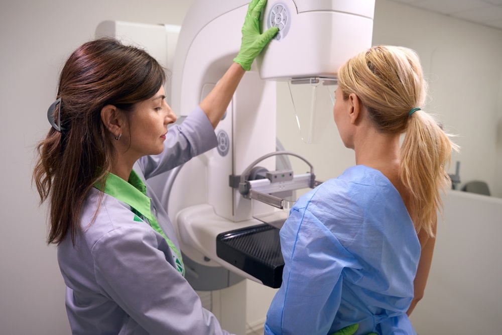 Mammogram led by female clinician on patient