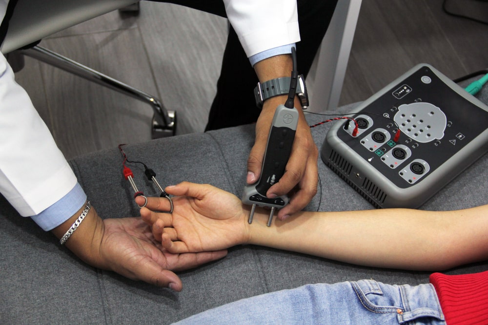Nerve conduction studies on patient's forearm